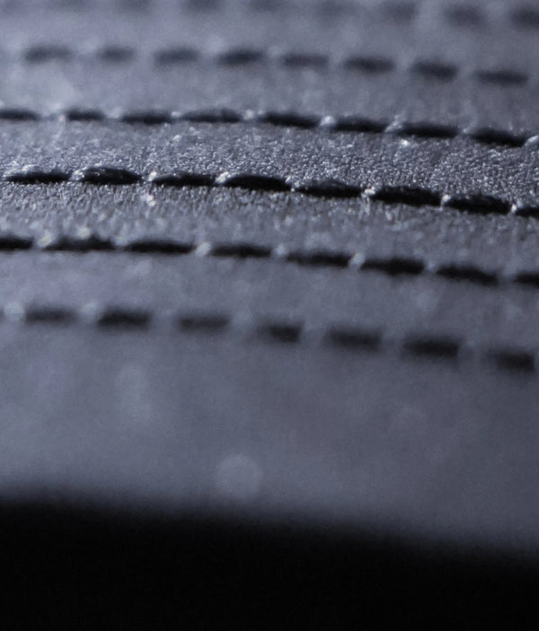 Durable fabric made to last. Custom button and interior lining.