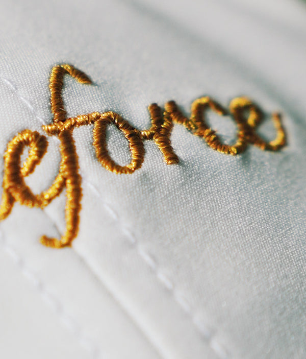 Gold embroidered design for a premium and classic feel.